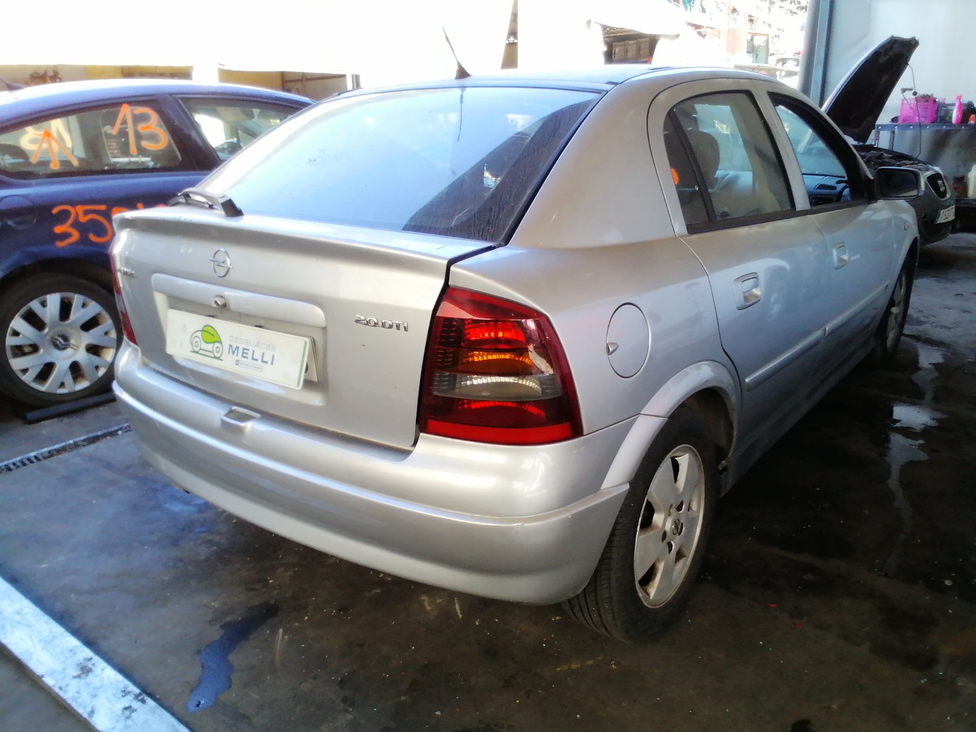 MAZDA 323 BA (1994-2000) Освещение номерного знака 09153163 25682048